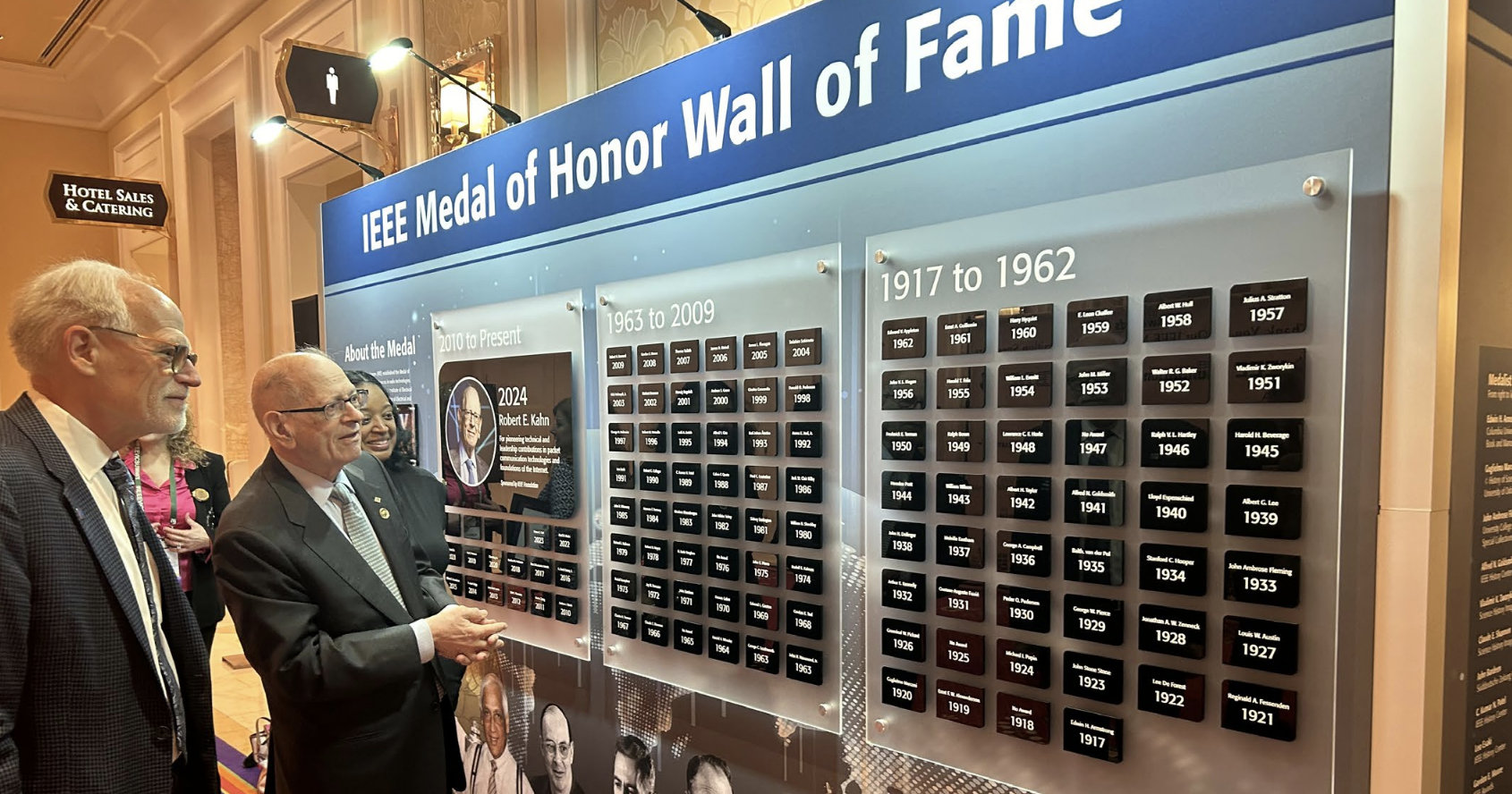 Meal of Honor Wall, people reviewing it